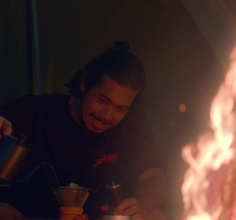 man and campfire