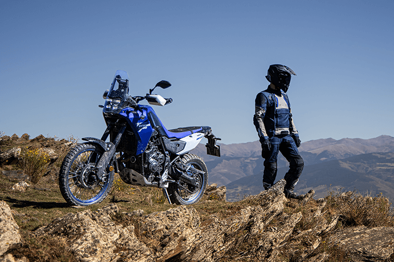 man and motor on top of hill