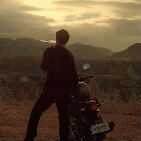 man and motor sunset