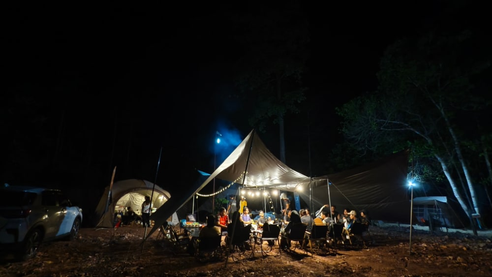 motorcycle riders gathered at a tent
