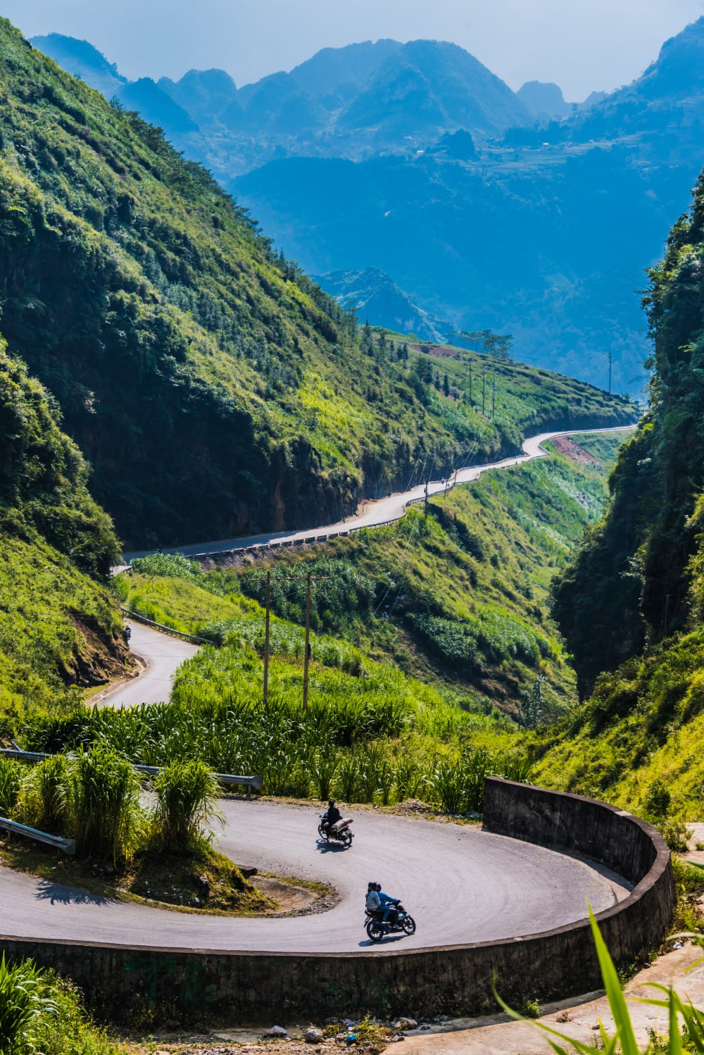 motorcycle riders on a curved trail