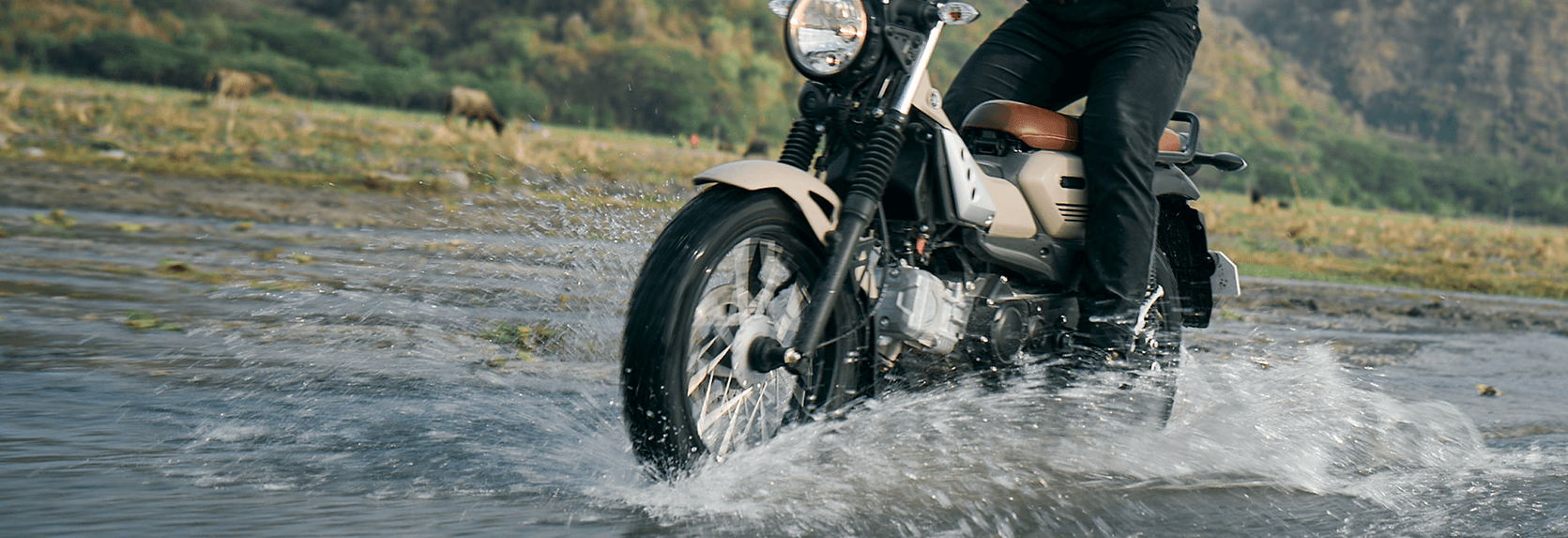 rider making its way to the water puddle